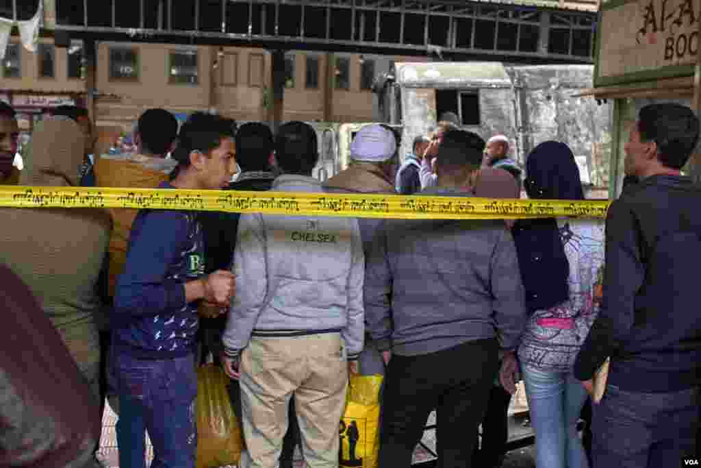 Passengers gather at the accident scene after the crash, Feb. 27, 2019. (H. Elrasam/VOA)