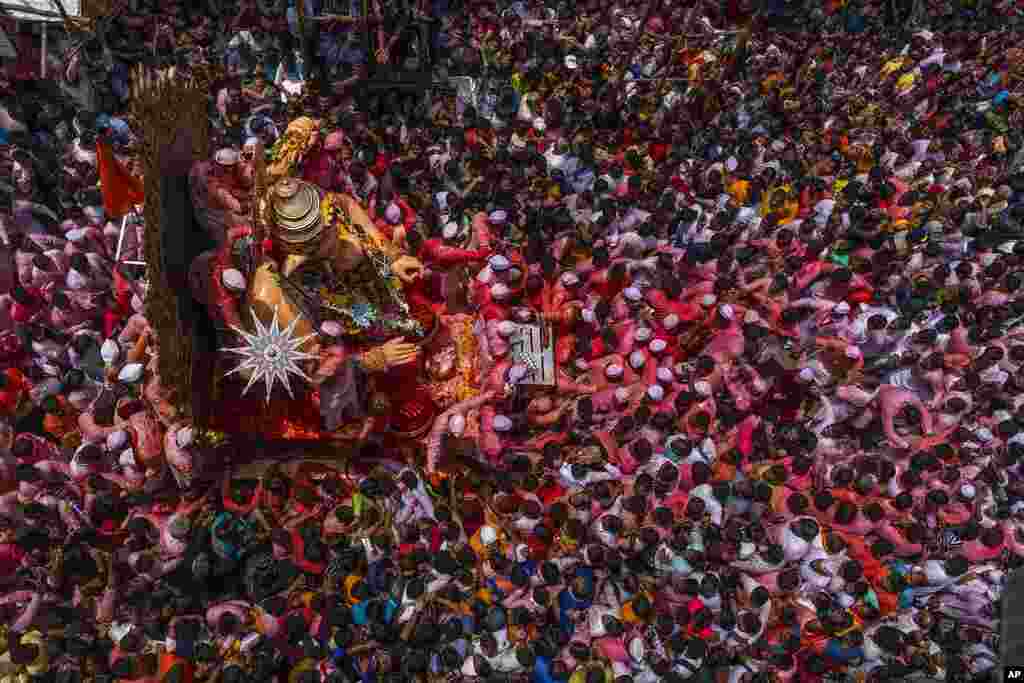 An idol of elephant-headed Hindu god Ganesha is taken for immersion on the final day of the 10-day-long Ganesh Chaturthi festival in Mumbai, India.