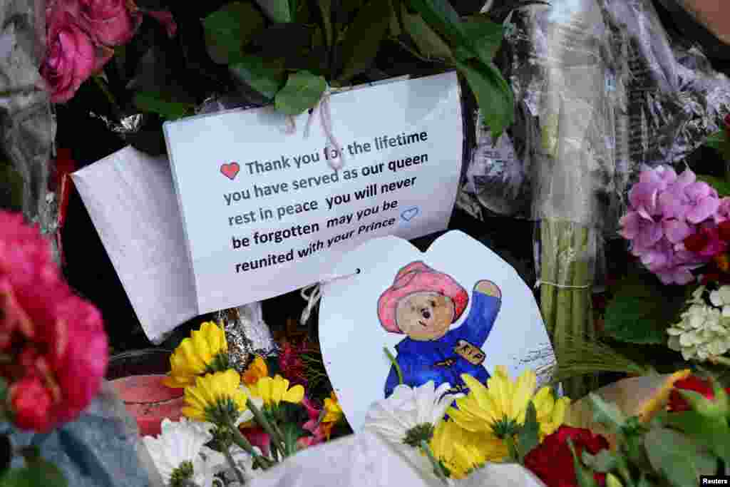 Flowers and notes are pictured at the gate, following the passing of Britain's Queen Elizabeth, at the Sandringham Estate in eastern England.
