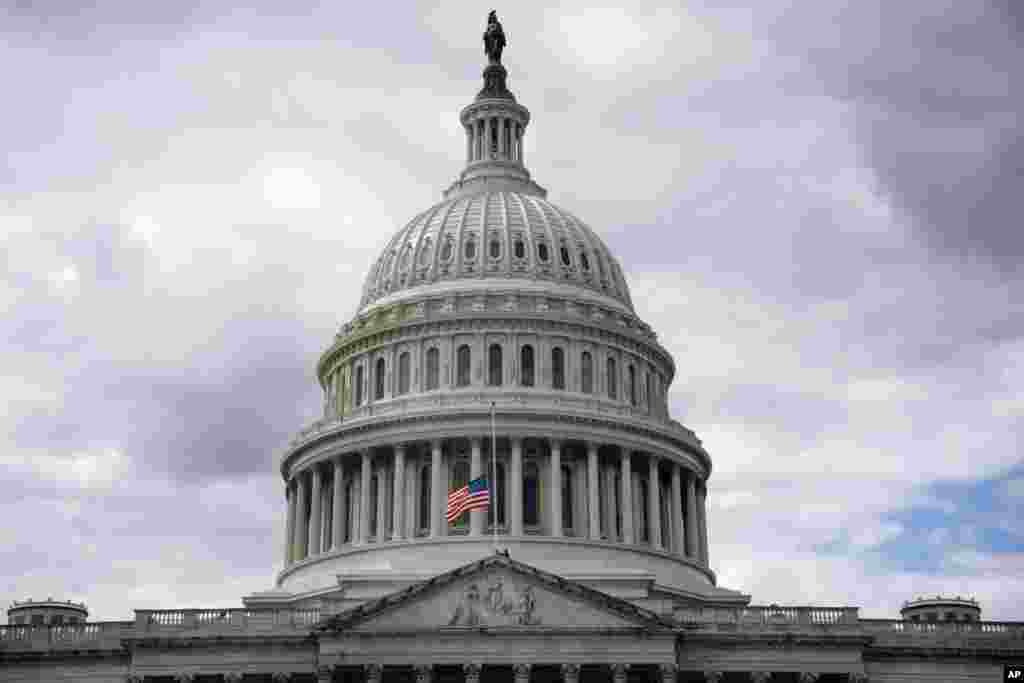 The American flag is lowered to half-staff over the U.S. Capitol, Sept. 8, 2022, on Capitol Hill in Washington, after Queen Elizabeth II, Britain's longest-reigning monarch and a rock of stability across much of a turbulent century, died after 70 years on the throne.