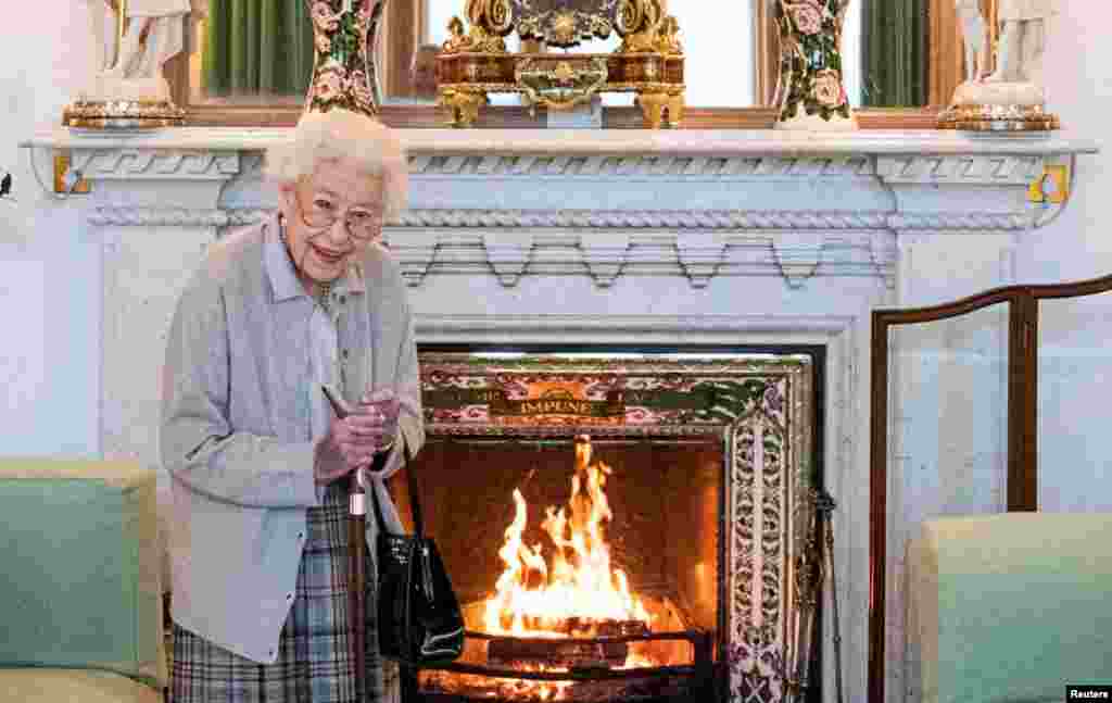 Britain's Queen Elizabeth waits in the Drawing Room before receiving Liz Truss, the newly elected leader of the Conservative Party, at Balmoral Castle, Scotland, Sept. 6, 2022.