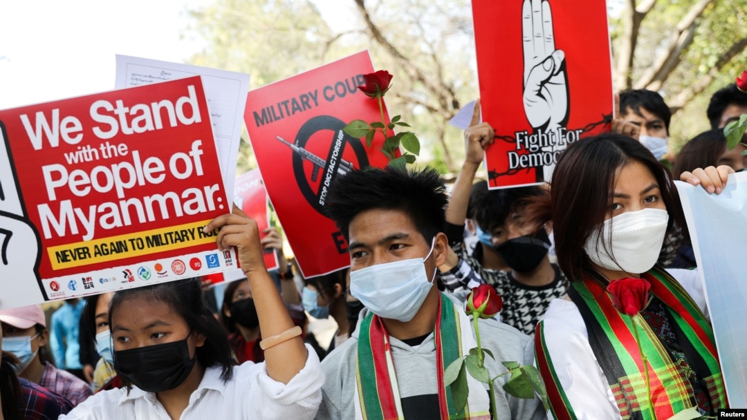 FILE - Myanmar citizens living in India attend a protest against the military coup in Myanmar and demanding recognition of the National Unity Government of Myanmar, in New Delhi, Feb. 22, 2022. 