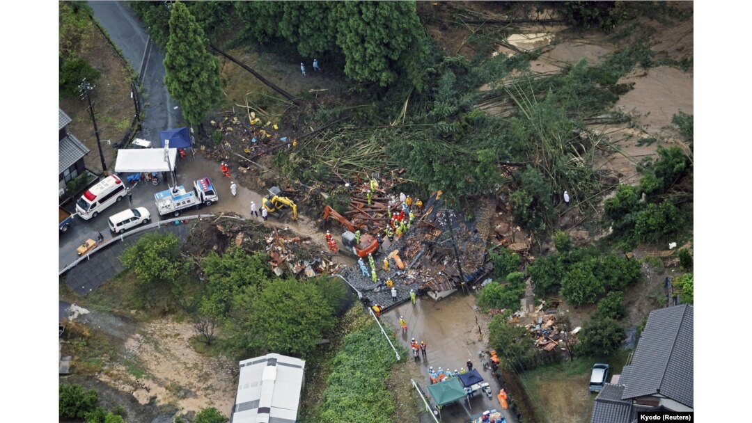 An aerial view shows rescue workers conducting search and rescue operation at a landslide site caused by a heavy rain due to the approach of Typhoon Shanshan in Gamagori, Aichi Prefecture, central Japan, Aug. 28, 2024, in this photo taken by Kyodo.