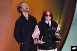 Finneas, left, and Billie Eilish accept the award for song of the year for "What Was I Made For?" during the 66th annual Grammy Awards on Sunday, Feb. 4, 2024, in Los Angeles. (AP Photo/Chris Pizzello)