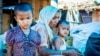 Members of a Rohingya refugee family at a ramshackle shanty colony in the north Indian state of Haryana. (Zafor Alom/VOA)