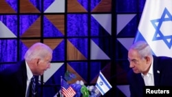 Rais wa Marekani Joe Biden akiwa katika mazungmzo na waziri mkuu wa Israel Benjamin Netanyahu Oktoba 18, 2023