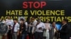 FILE - Activists and members representing the Christian community take part in a protest against what they claim as an increase in hostility, hate, and violence against Christians in various parts of India, in New Delhi, Feb. 19, 2023.