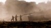 Israeli soldiers clean a tank gun barrel after returning from the Gaza Strip, amid the ongoing conflict between Israel and Hamas, near the Israel-Gaza border, in Israel, June 5, 2024.