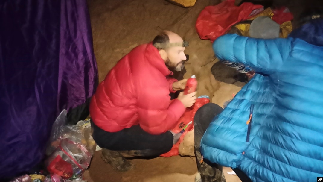 American caver Mark Dickey, left, 40, talks to a colleague inside the Morca cave near Anamur, southern Turkey, Sept. 7, 2023. 