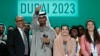 From left, U.N. Climate Chief Simon Stiell, COP28 President Sultan al-Jaber and chief COP28 negotiator for the United Arab Emirates Hana Al-Hashimi pose for a photo at the end of the COP28 U.N. Climate Summit in Dubai, UAE, Dec. 13, 2023.