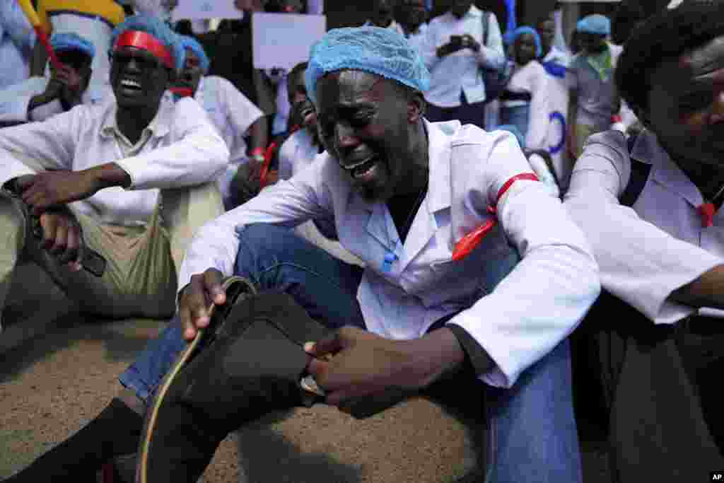 Doctors and other medical staff take part in a protest in downtown Nairobi, Kenya. Hundreds of doctors have protested in the streets demanding better pay and working conditions in an ongoing nationwide strike for about a month.