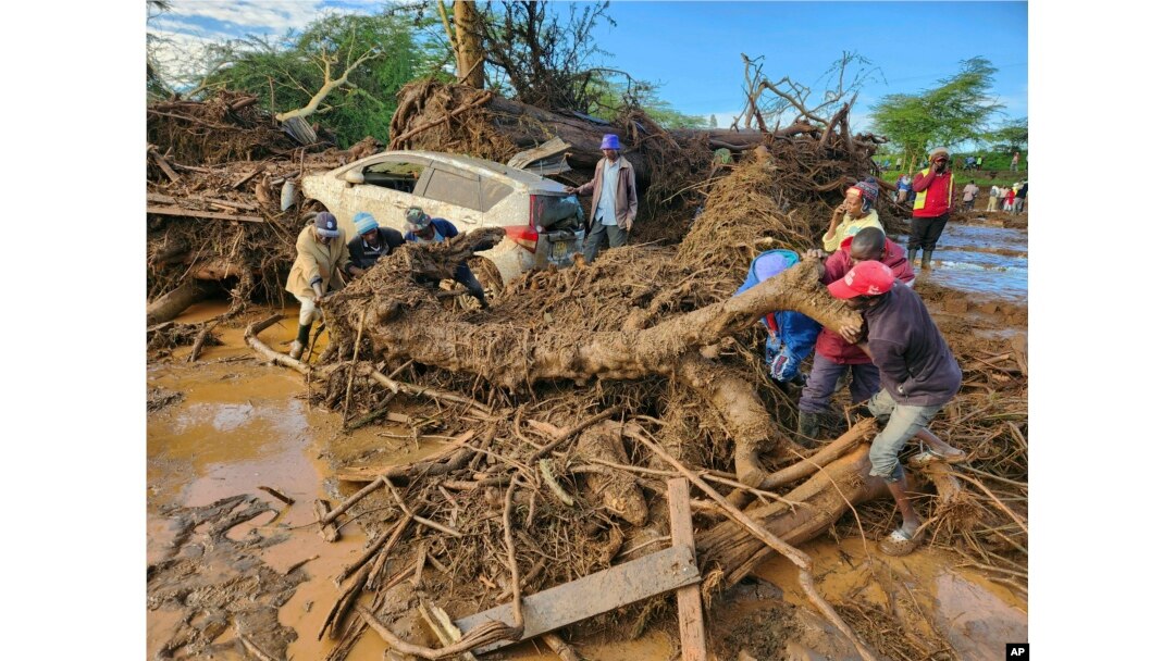 People try to clear debris after devastating flooding in Kamuchiri village, Mai Mahiu, Nakuru County, Kenya, April 29, 2024.
