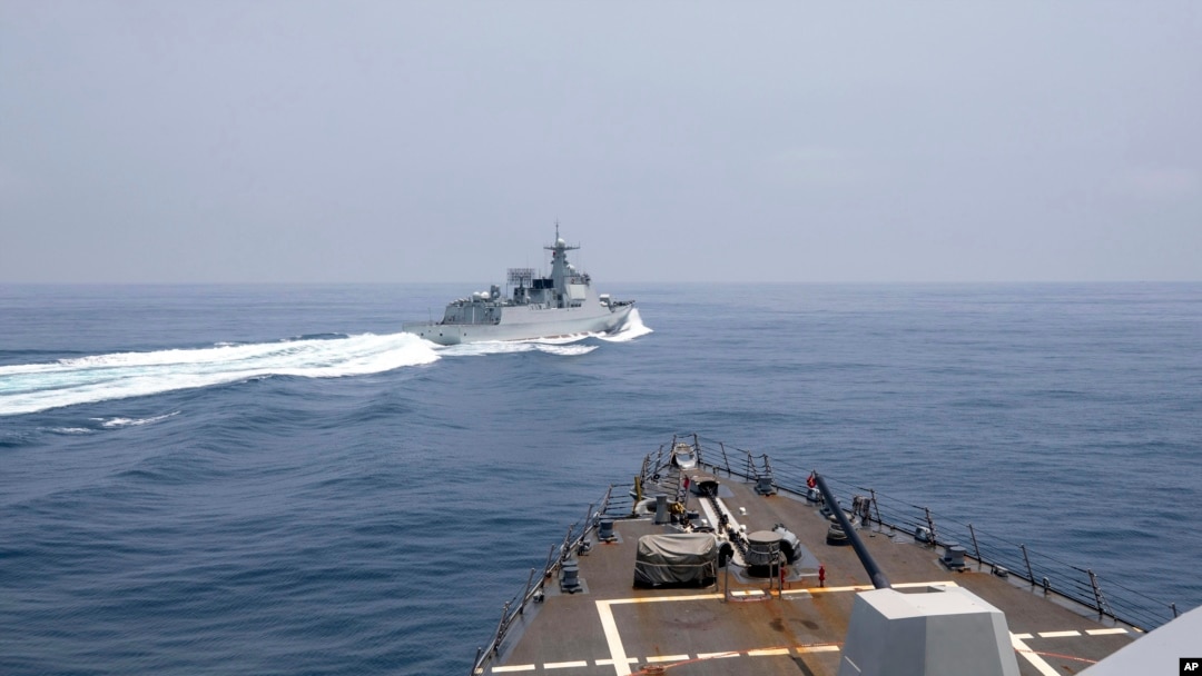 FILE - In this photo provided by the U.S. Navy, the USS Chung-Hoon observes a Chinese navy ship conduct what the U.S. called an "unsafe” Chinese maneuver in the Taiwan Strait, June 3, 2023. (U.S. Navy via AP)