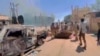 RSF fighters stand near the damaged Air Defence Forces command center in Khartoum, Sudan, May 17, 2023, in this screen grab obtained from a social media video. (RSF via Twitter/via Reuters)