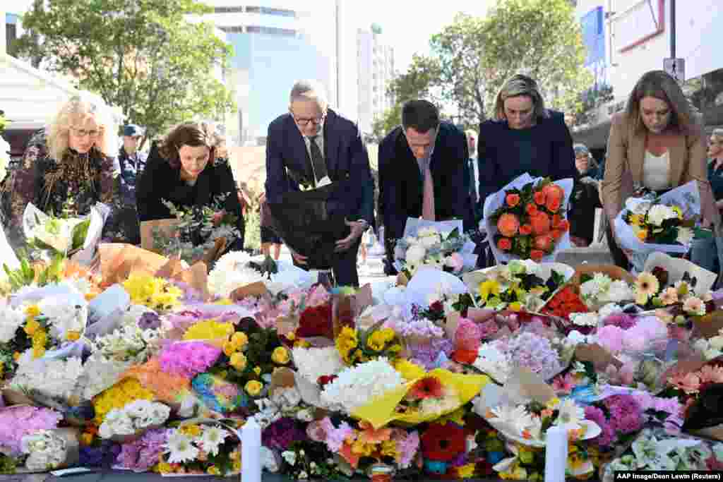 Australian Prime Minister Anthony Albanese and New South Wales Premier Chris Minns join other politicians as they lay flowers at the scene of Saturday's mass stabbing at Bondi Junction, Sydney.