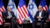 FILE - U.S. President Joe Biden, left, pauses during a meeting with Israeli Prime Minister Benjamin Netanyahu, in Tel Aviv, Israel, Oct. 18, 2023.