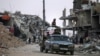 Palestinians who fled Rafah in the southern Gaza Strip arrive with their belongings to Khan Younis, May 15, 2024.