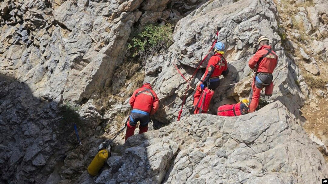 European Cave Rescue Association (ECRA) members work next to the entrance of Morca cave near Anamur, southern Turkey, Sept. 7, 2023.