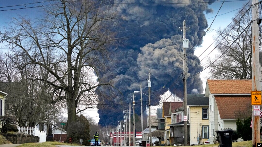 FILE - A plume rises over East Palestine, Ohio, as a result of the controlled detonation of a portion of the derailed Norfolk Southern trains, Feb. 6, 2023. 