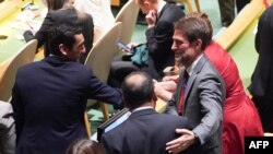 Members of the Albanian delegation celebrate as the UN General Assembly elects new members to the Human Rights Council, at UN headquarters in New York City, Oct. 10, 2023.