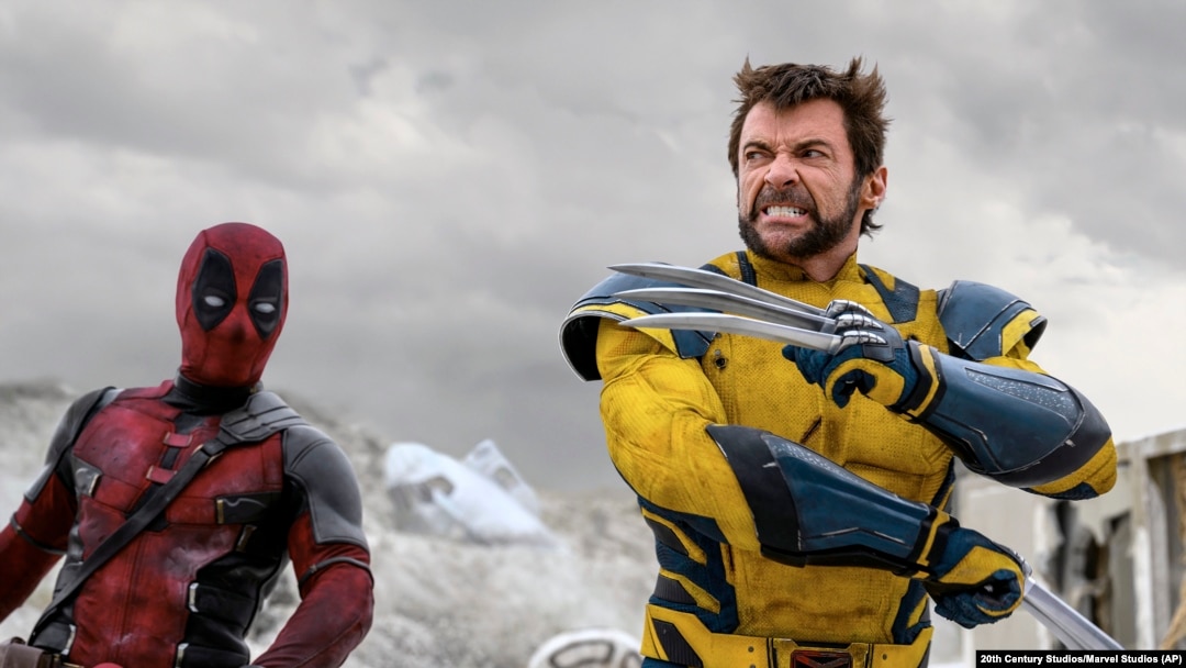 This image released by 20th Century Studios/Marvel Studios shows Ryan Reynolds as Deadpool/Wade Wilson, left, and Hugh Jackman as Wolverine/Logan in a scene from "Deadpool & Wolverine."