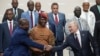 FILE - Russian President Vladimir Putin, right, and Mozambique President Filipe Nyusi shake hands at the Russia Africa Summit in St. Petersburg, Russia, July 28, 2023. Putin denies he is seeking to oust Western influence in Africa. "We're just being friends with them," he said. 