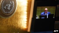 UN General Assembly President Dennis Francis reads the election results of new members to the Human Rights Council, at UN headquarters in New York City, Oct. 10, 2023. 