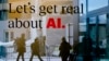 FILE - People are reflected in a window of a hotel at the the World Economic Forum in Davos, Switzerland, Jan. 15, 2024. The U.N. General Assembly on March 21, 2024, adopted a resolution regarding the potential — good and bad — of artificial intelligence.