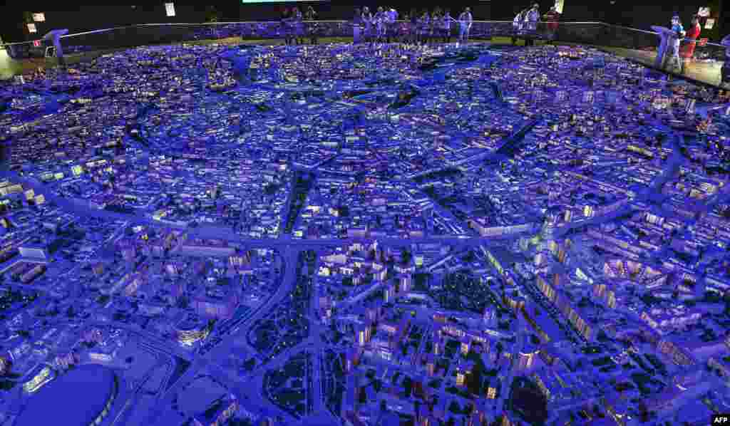 Visitors inspect the exhibition "The Model of Moscow" in Moscow.