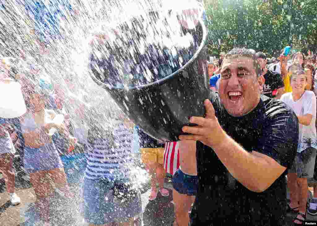 Revelers take part in the annual "Naval Battle" of Vallecas in Madrid, Spain.