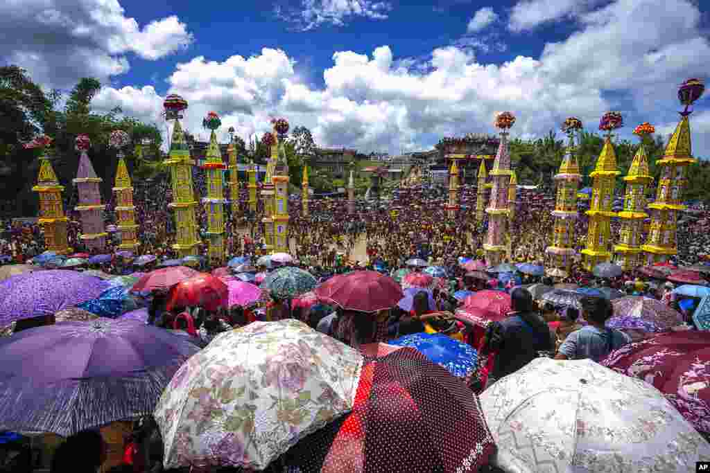 Pnar, or Jaintia, tribals carry "Rongs" or chariots, and dance in muddy waters during Behdienkhlam festival celebrations in Tuber village, in the northeastern state of Meghalaya, India. Behdienkhlam is a traditional festival of the Pnars celebrated after sowing is done seeking a good harvest and to drive away plague and diseases.
