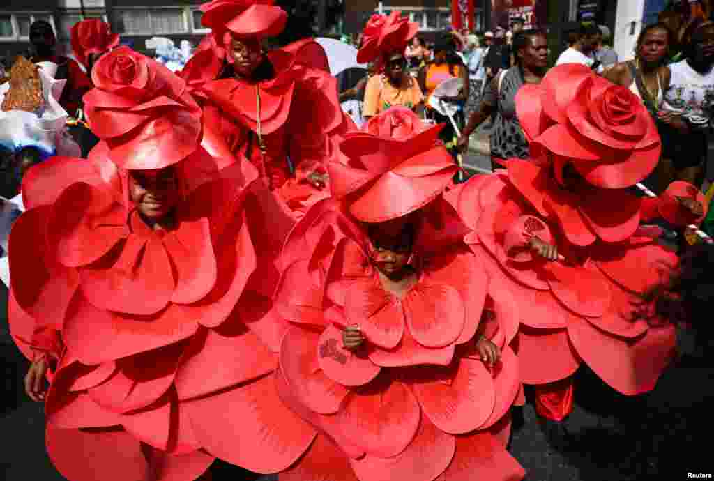 Revelers take part in the Children's Parade at Notting Hill Carnival in London.