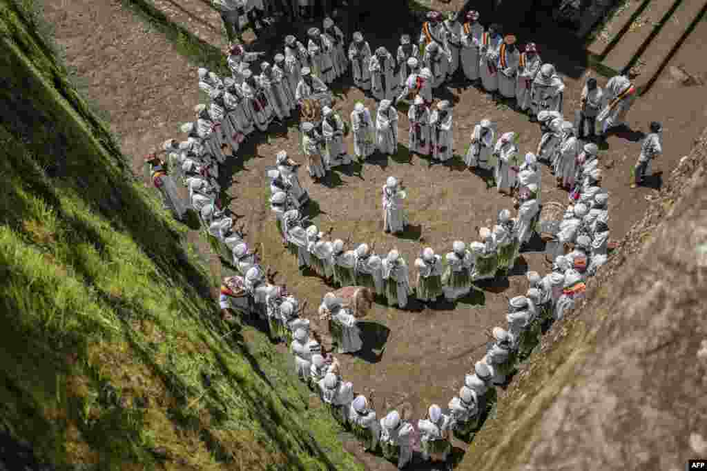 Young women sing during Ashenda festival at Saint George Church in Lalibela, Ethiopia.