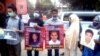 With photos of their relatives who disappeared after allegedly being picked up or abducted by security agencies, people formed a human chain at a rally in Dhaka on International Human Rights Day, Dec. 10, 2021. (Photo by Tazul Islam for VOA)