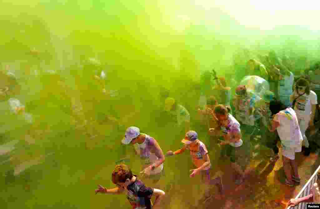 Participants take part in Color Run event in Jurmala, Latvia.