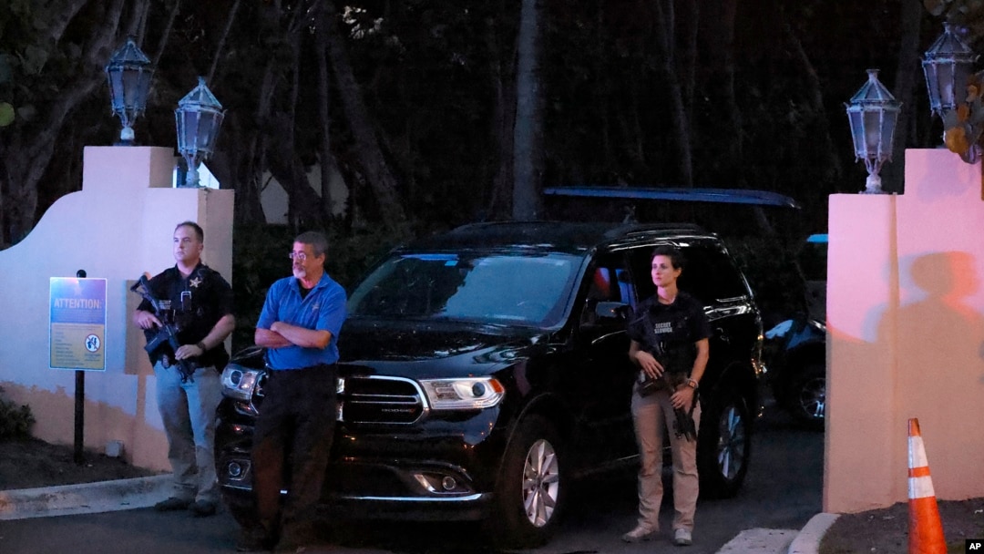 Armed Secret Service agents stand outside an entrance to former President Donald Trump's Mar-a-Lago estate, Aug. 8, 2022, in Palm Beach, Florida. 