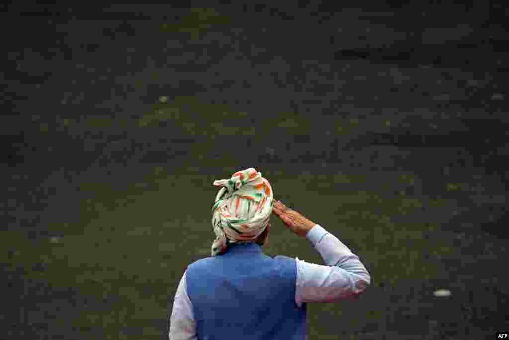 India's Prime Minister Narendra Modi inspects a guard of honor before addressing the nation from the ramparts of the Red Fort during the celebrations to mark countrys Independence Day in New Delhi.