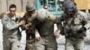 FILE - An Afghan soldier and a U.S. soldier were injured by a roadside bomb blast, Sept. 18, 2010. Such blasts can cause to traumatic brain injuries and internal bleeding. Researchers are looking at ways to better treat such injuries.