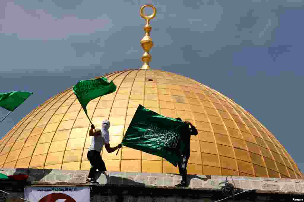 Palestinians protest at the compound that houses Al-Aqsa Mosque, known to Muslims as the Noble Sanctuary and to Jews as the Temple Mount, in Jerusalem's Old City.