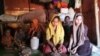 An unidentified Rohingya family is seen at their Cox's Bazar shanty in Bangladesh. Refugees in Bangladesh have for years sought to go to work and live in Malaysia. (Noor Hossain/VOA)