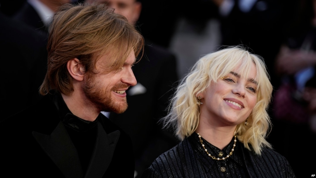 FILE - Finneas O'Connell, left, and Billie Eilish poses for photographers upon arrival for the World premiere of the new film from the James Bond franchise "No Time To Die," in London, on Sept. 28, 2021. They will perform a musical number at the 2022 Osca
