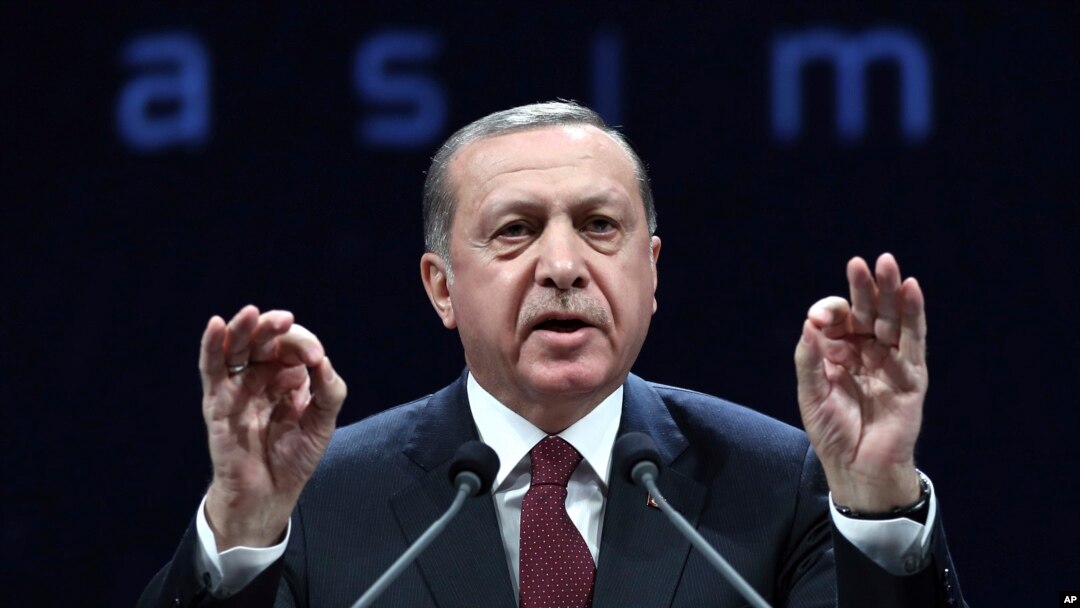 Turkey's President addresses police officers in Ankara, Turkey, Nov. 22, 2016. Turkey's government on Tuesday dismissed an additional 15,000 people from the military, police and the civil service as part of an ongoing investigation into the failed military coup in July.