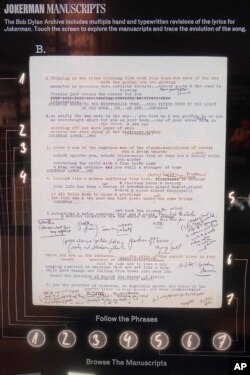 A manuscript for 'Jokerman' in an interactive display at the Bob Dylan Center, May 5, 2022, in Tulsa, Okla.