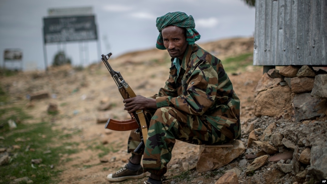 FILE - A fighter loyal to the Tigray People's Liberation Front (TPLF) mans a guard post on the outskirts of the town of Hawzen, then-controlled by the group but later re-taken by government forces, in the Tigray region of northern Ethiopia on May 7, 2021.