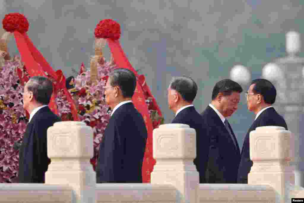 Chinese leaders, led by President Xi Jinping, lay wreaths on Tiananmen Square to mark Martyrs' Day on the eve of the National Day in Beijing, China