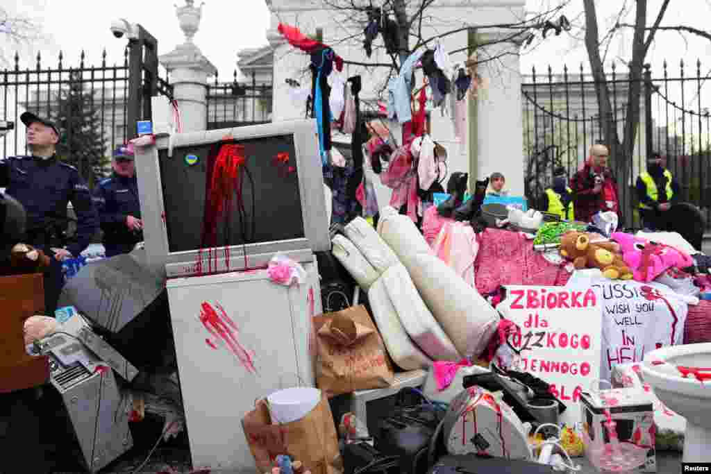 People take part in an anti-Russian demonstration outside the Russian Embassy in Warsaw, Poland, amid Russia's invasion of Ukraine.
