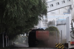 A truck transports coal at a coal-fired power plant in Shenyang on China September 29, 2021.