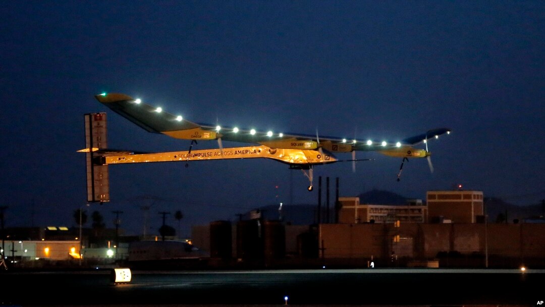 Solar Impulse, piloted by André Borschberg, takes flight during the second leg of the 2013 Across America mission, at dawn, May 22, 2013, from Sky Harbor International Airport in Phoenix. 