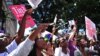 FILE - Women chant slogans during a rally to protest violence against women, in Nairobi, Kenya, Nov. 17, 2014. 