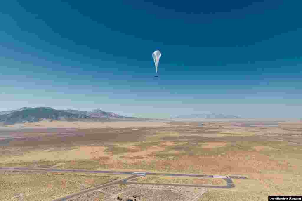 A Loon internet balloon, carrying solar-powered mobile networking equipment flies over the company's launch site in Winnemucca, Nevada.